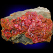 Dense Realgar Crystals Covering Matrix